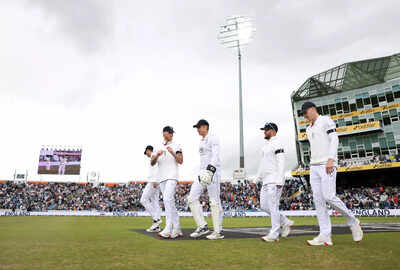 England captain Ben Stokes leads his team onto the field.
