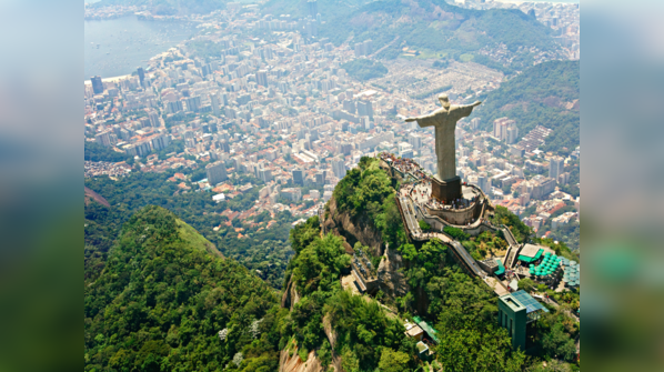 A statue of Christ with outstretched arms, overlooking Rio