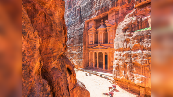 An ancient city carved into sandstone cliffs