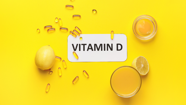 Glass of milk and vitamin D pills