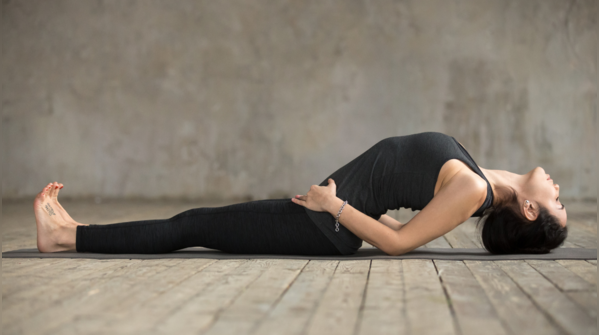 Individual performing Matsyasana, Fish Pose.
