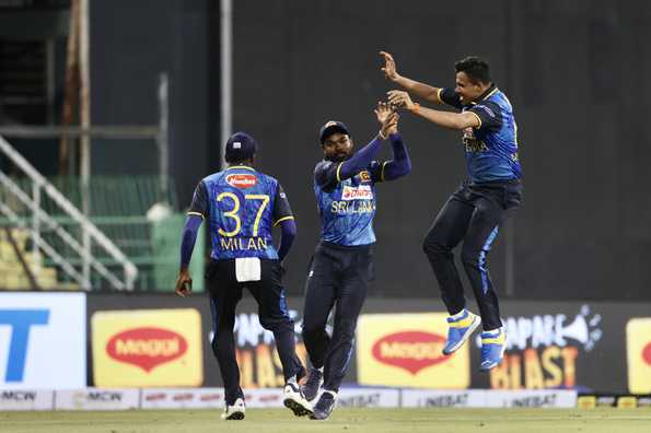 Sri Lankan fielders celebrate a crucial catch.